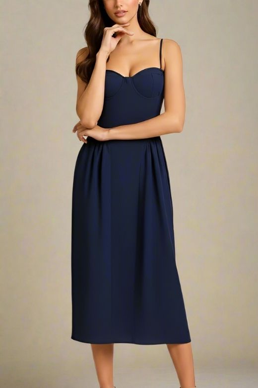Woman wearing a figure flattering Everly Midi Dress - Navy Blue BODYCON COLLECTION