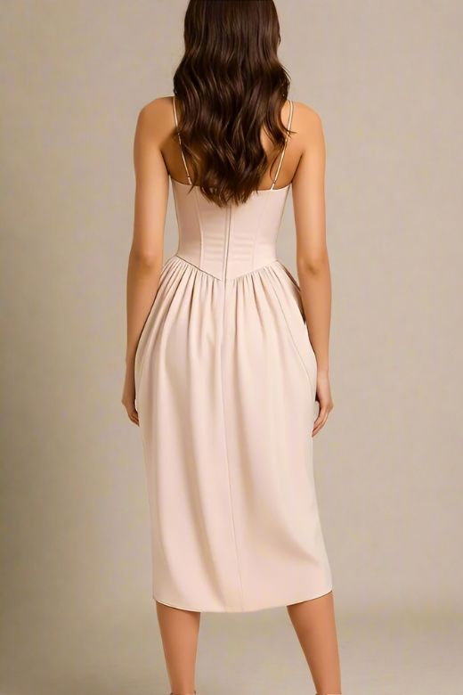 Woman wearing a figure flattering  Everly Midi Dress - Peach BODYCON COLLECTION