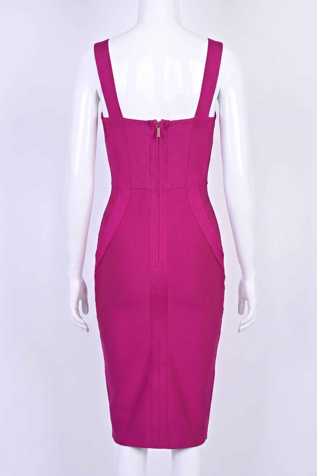 Woman wearing a figure flattering Freya Bandage Dress - Magenta Pink BODYCON COLLECTION