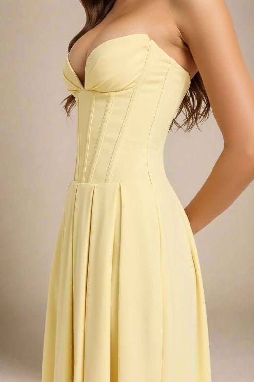 Woman wearing a figure flattering Gabbi Bodycon Midi Dress - Sun Yellow BODYCON COLLECTION