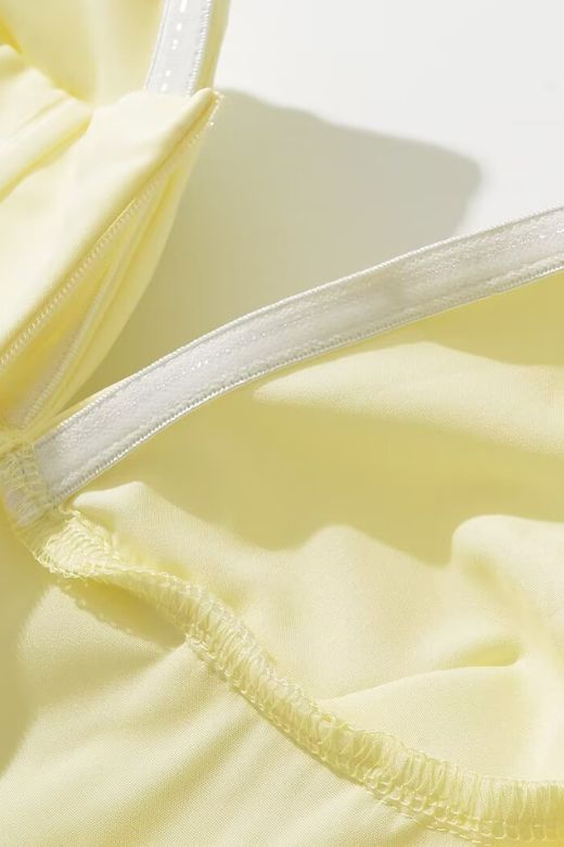 Woman wearing a figure flattering Gabbi Bodycon Midi Dress - Sun Yellow BODYCON COLLECTION