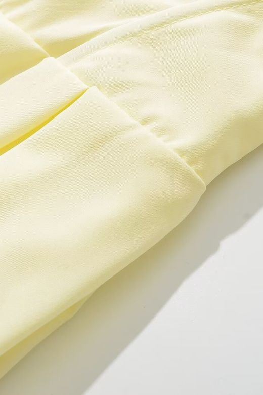 Woman wearing a figure flattering Gabbi Bodycon Midi Dress - Sun Yellow BODYCON COLLECTION