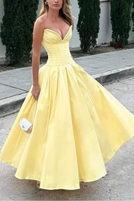 Woman wearing a figure flattering Gabbi Bodycon Midi Dress - Sun Yellow BODYCON COLLECTION