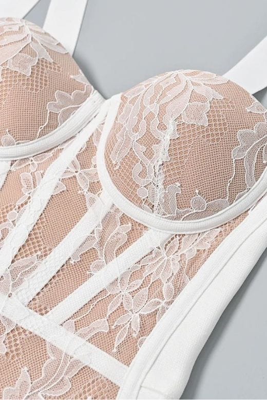 Woman wearing a figure flattering  Genevieve Bodycon Lace Midi Dress - Pearl White BODYCON COLLECTION