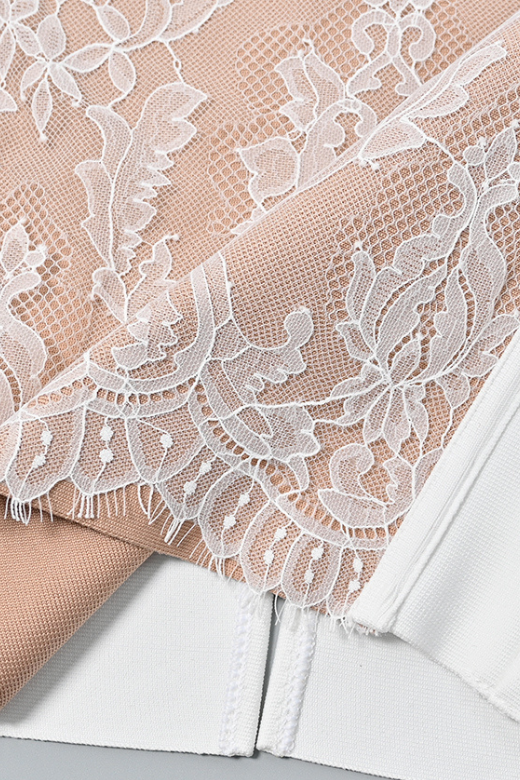 Woman wearing a figure flattering  Genevieve Bodycon Lace Midi Dress - White Pearl BODYCON COLLECTION