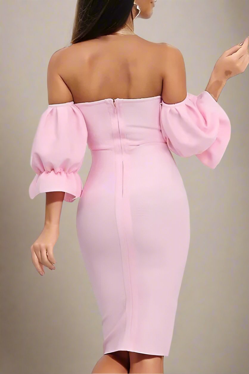 Woman wearing a figure flattering Georgia Bodycon Dress - Dusty Pink BODYCON COLLECTION
