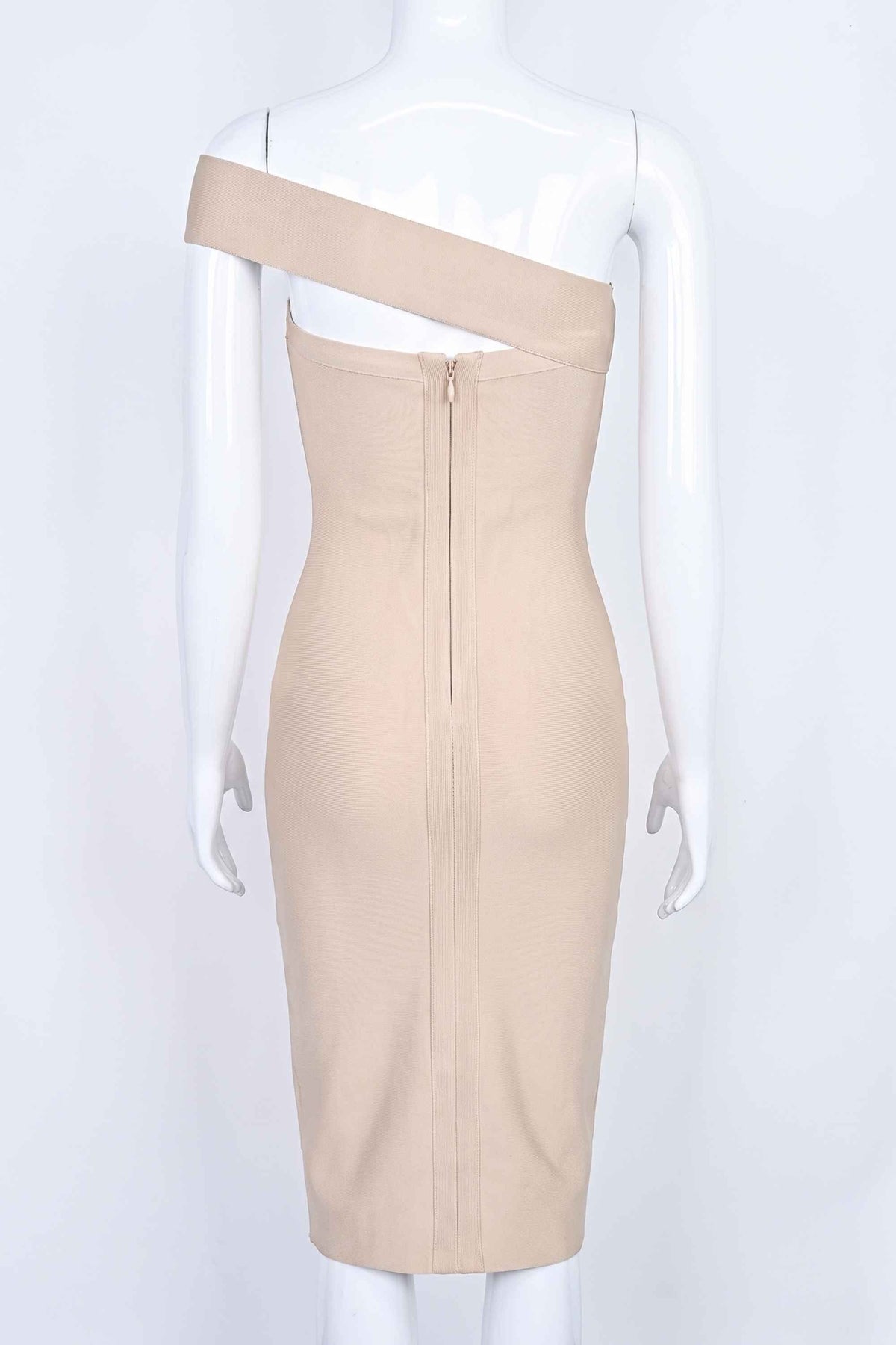 Woman wearing a figure flattering Gianna Bandage Dress - Nude BODYCON COLLECTION
