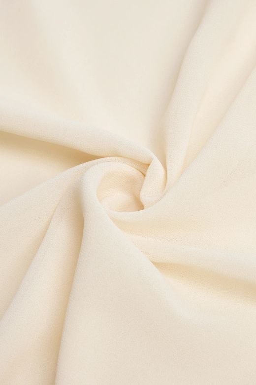 Woman wearing a figure flattering Harlow Bodycon Maxi Wrap Dress - Beige Cream BODYCON COLLECTION