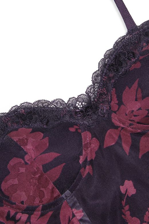 Woman wearing a figure flattering Harmony Bodycon Midi Dress - Classic Black BODYCON COLLECTION