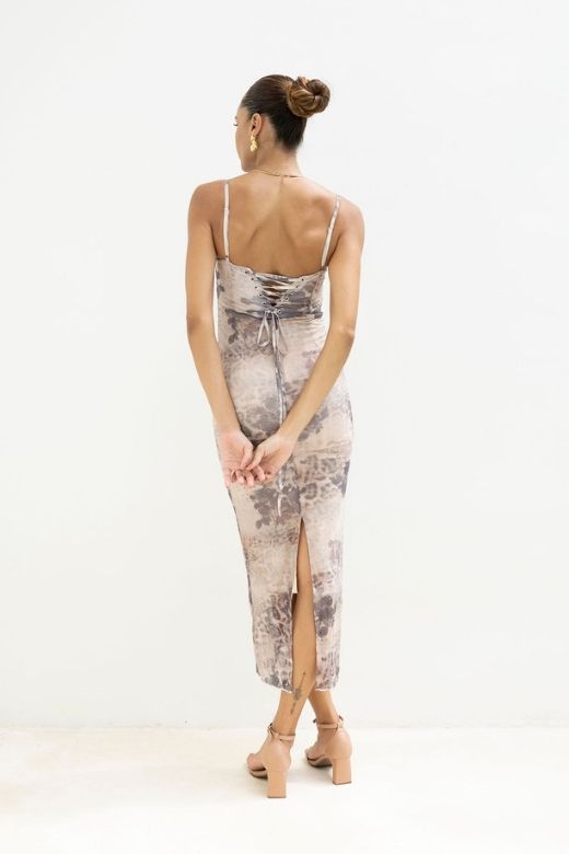 Woman wearing a figure flattering Harmony Bodycon Midi Dress - Nude BODYCON COLLECTION