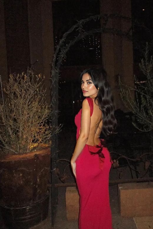 Woman wearing a figure flattering Harper Bodycon Maxi Dress - Classic Black BODYCON COLLECTION