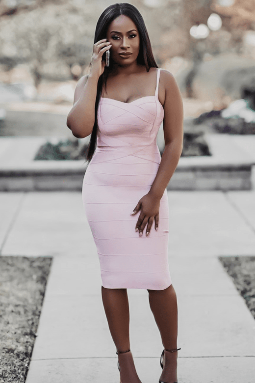 Woman wearing a figure flattering Heidi Bandage Midi Dress - Dusty Pink Bodycon Collection