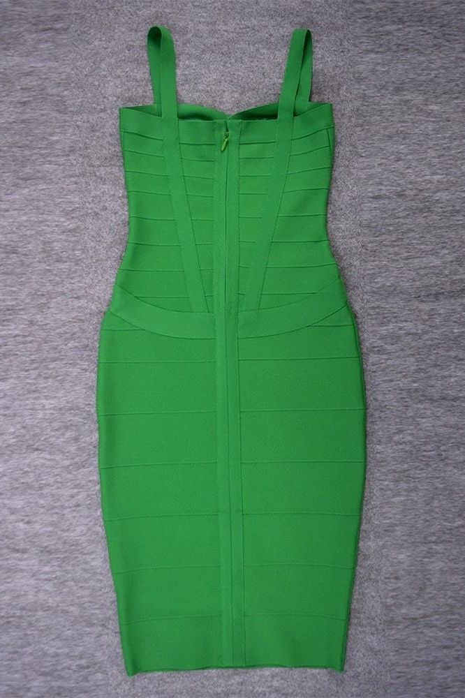Woman wearing a figure flattering Heidi Bandage Midi Dress - Emerald Green Bodycon Collection