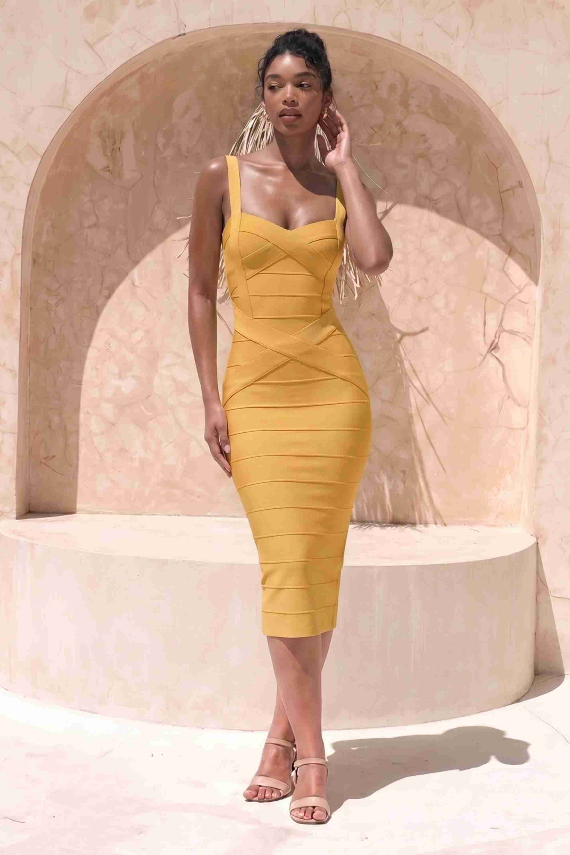 Woman wearing a figure flattering mustard yellow party dress Heidi Bandage Midi Dress - Mustard Yellow Bodycon Collection