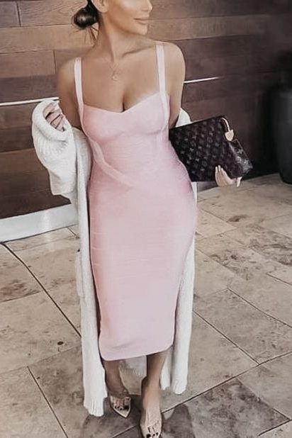 Woman wearing a figure flattering Heidi Bandage Midi Dress - Navy Blue Bodycon Collection
