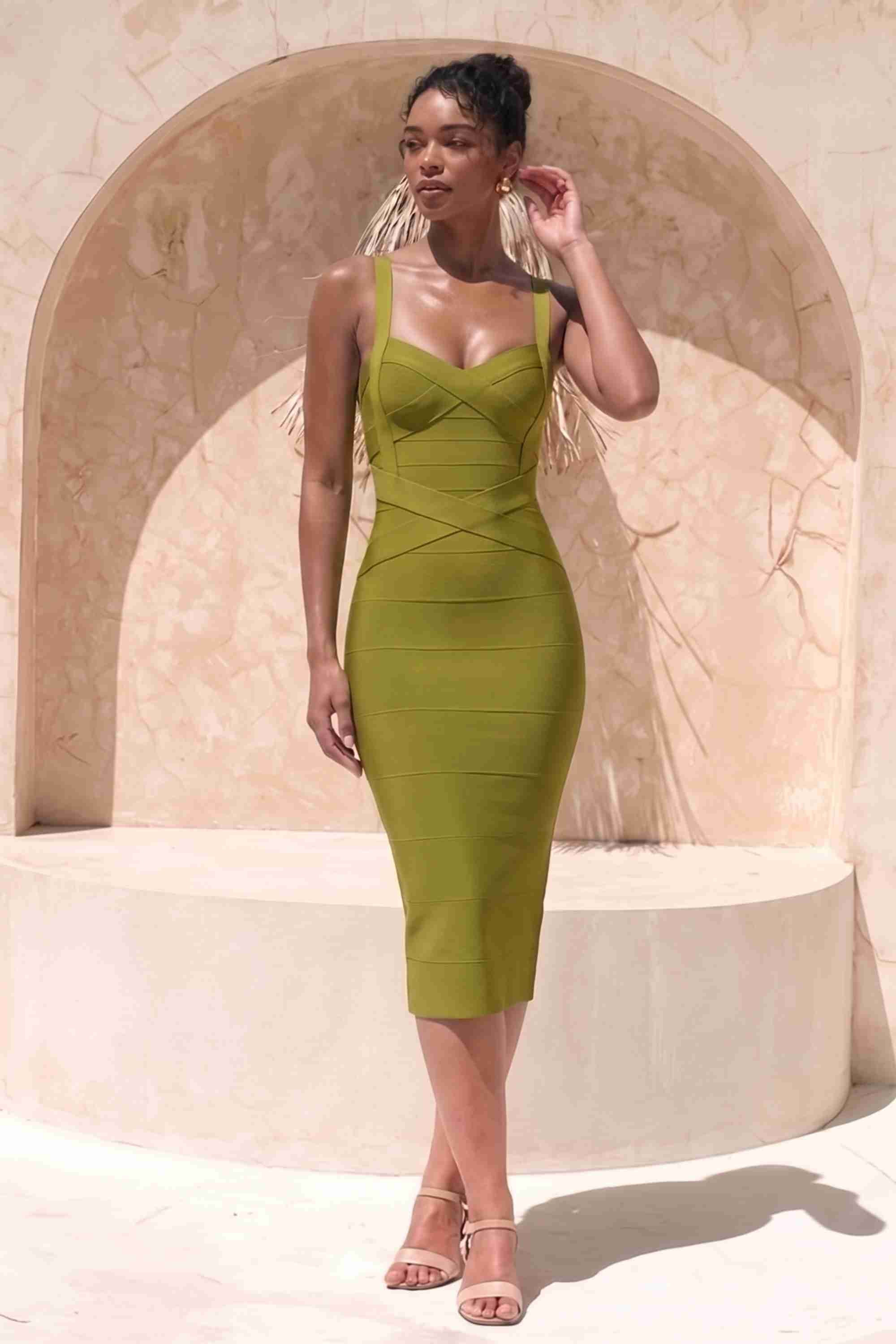Woman wearing a figure flattering Heidi Bandage Midi Dress - Olive Green Bodycon Collection