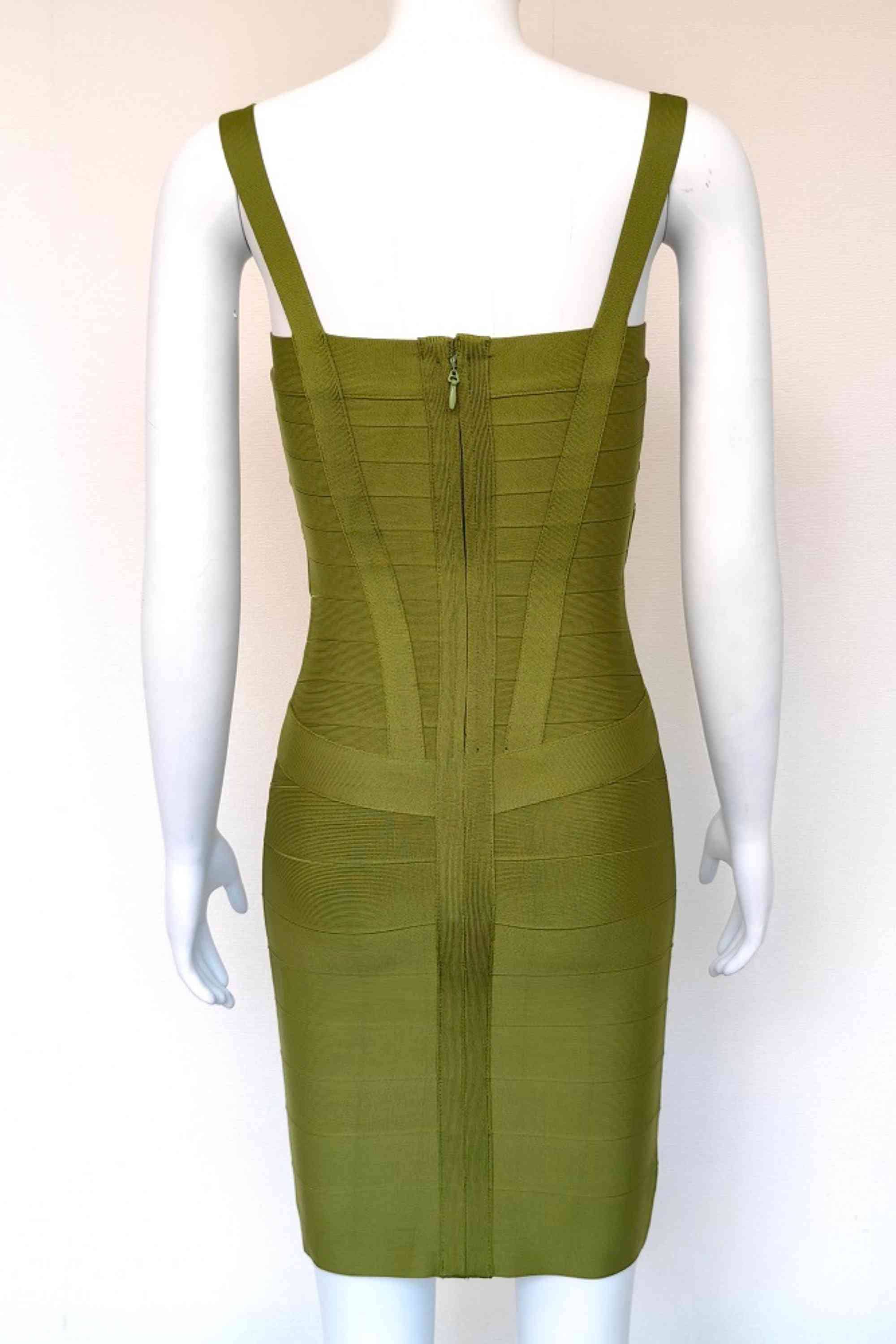 Woman wearing a figure flattering Heidi Bandage Mini Dress - Army Green Bodycon Collection