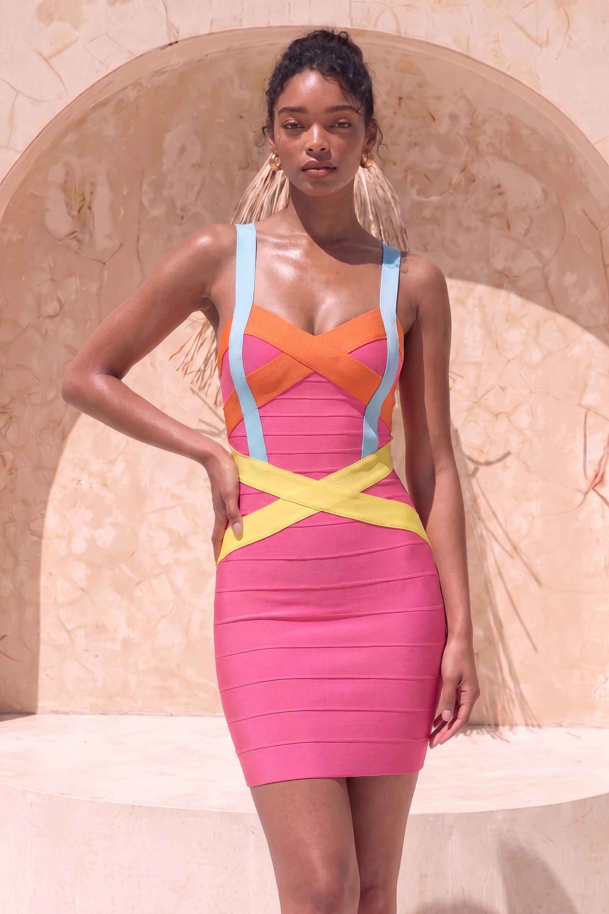 Woman wearing a figure flattering Heidi Bandage Mini Dress - Hot Pink Bodycon Collection
