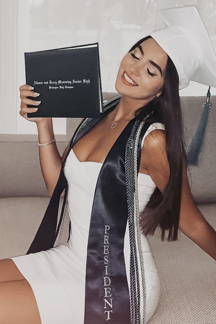 Woman wearing a figure flattering Heidi Bandage Mini Dress - Pearl White Bodycon Collection