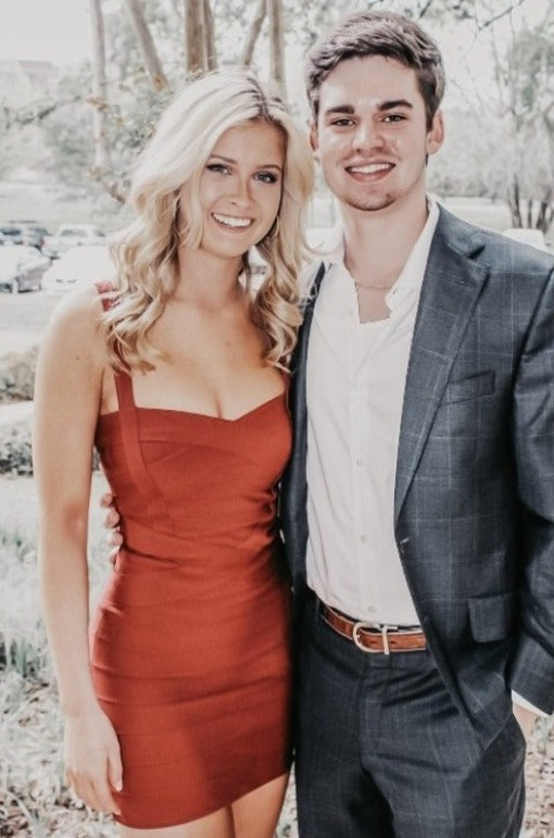 Woman wearing a figure flattering Heidi Bandage Mini Dress - Red Wine Bodycon Collection