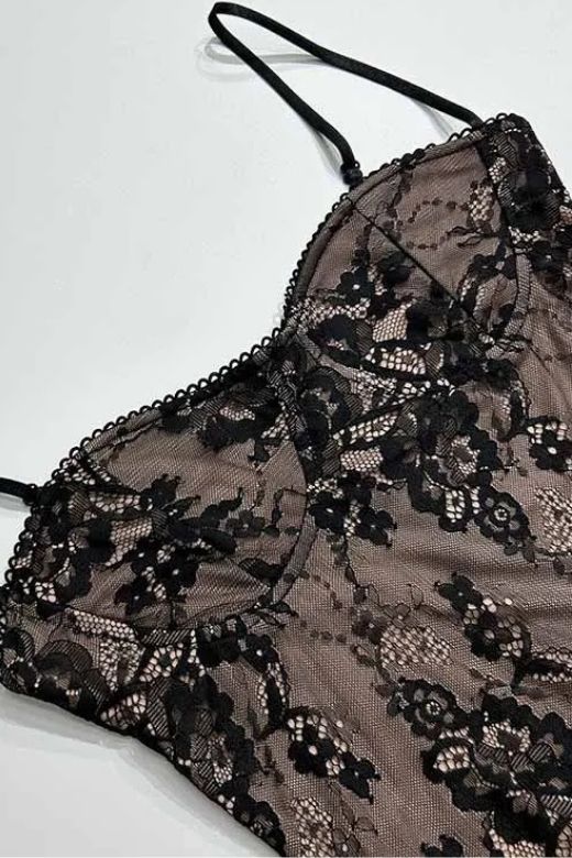 Woman wearing a figure flattering Joan Bodycon Dress - Classic Black BODYCON COLLECTION