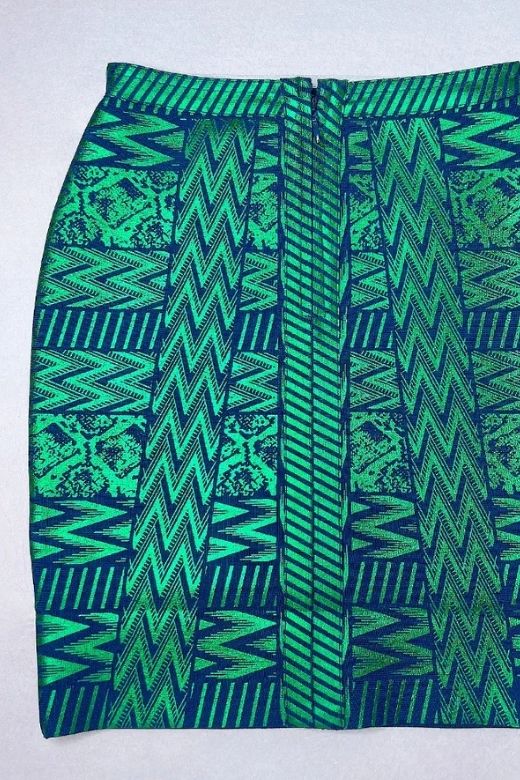 Woman wearing a figure flattering High Waist Metallic Mini Skirt - Emerald Green BODYCON COLLECTION