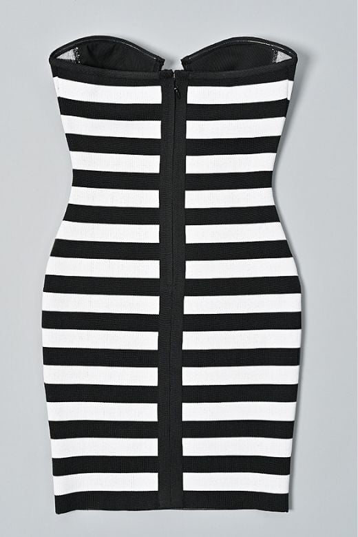 Woman wearing a figure flattering Ingrid Bandage Mini Dress - Classic Black BODYCON COLLECTION