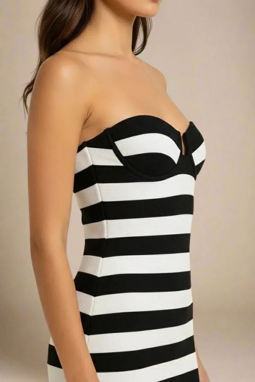 Woman wearing a figure flattering Ingrid Bandage Mini Dress - Classic Black BODYCON COLLECTION