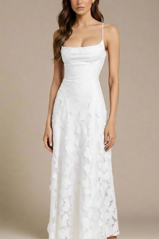 Woman wearing a figure flattering Ivy Bodycon Maxi Dress - White Pearl BODYCON COLLECTION