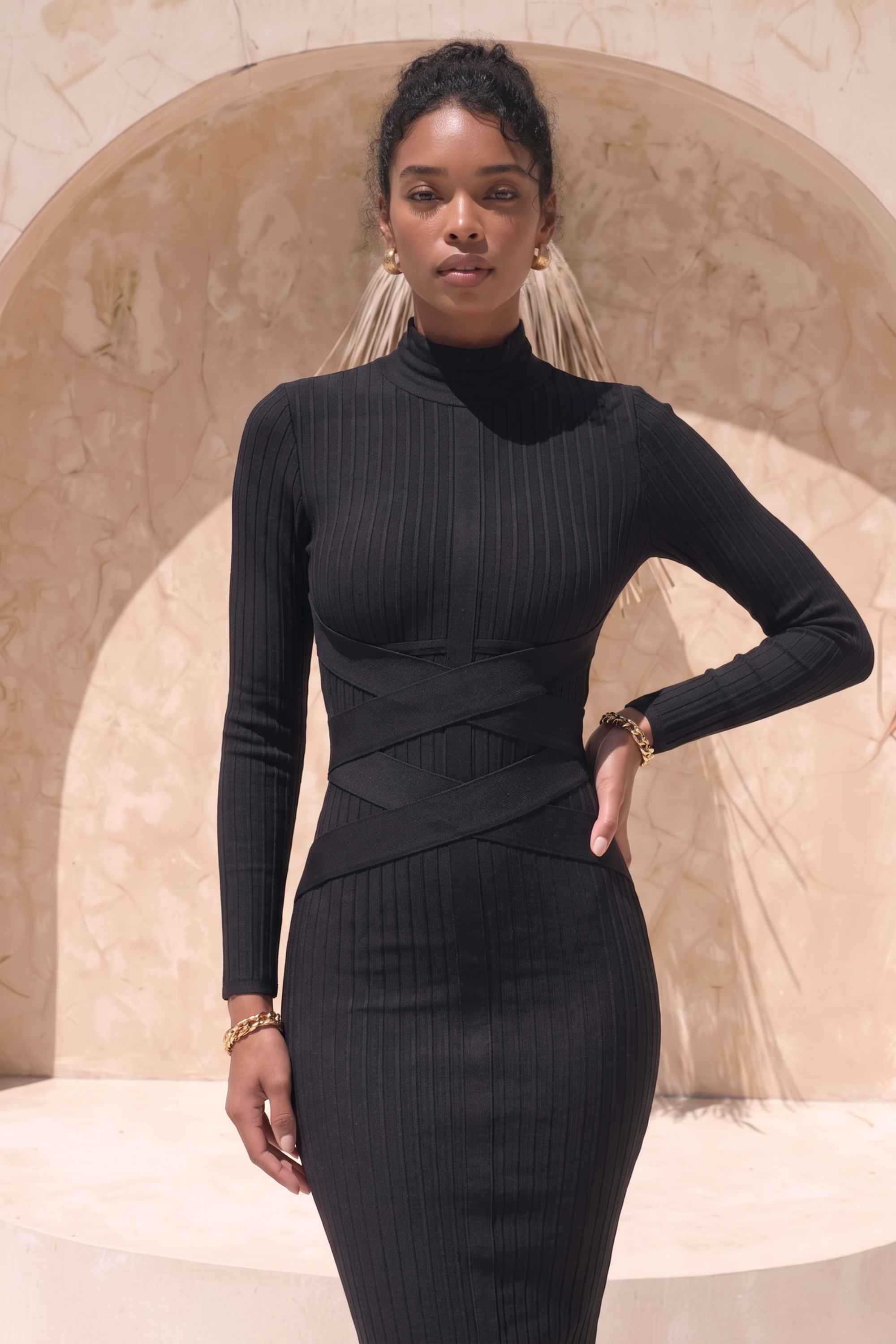 Woman wearing a figure flattering Jane Long Sleeve Bodycon Midi Dress - Classic Black Bodycon Collection