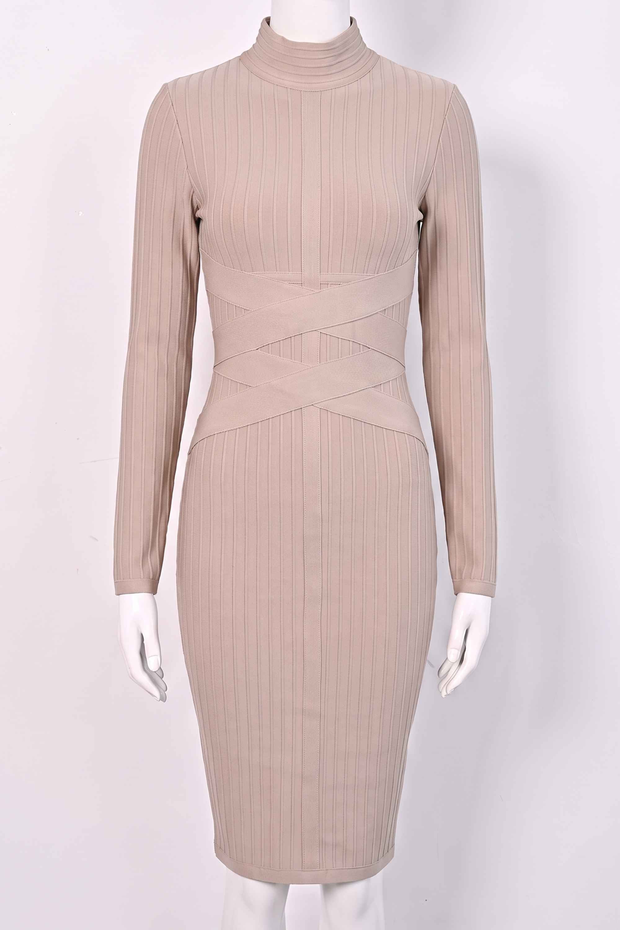 Woman wearing a figure flattering Jane Long Sleeve Bodycon Midi Dress - Nude Bodycon Collection