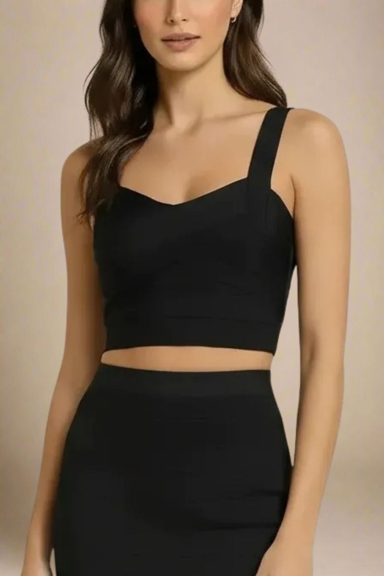 Woman wearing a figure flattering Jay Bandage Crop Top - Classic Black BODYCON COLLECTION
