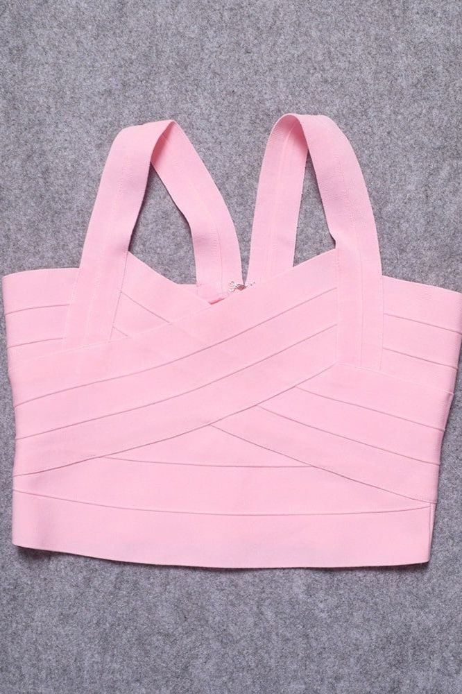 Woman wearing a figure flattering Jay Bandage Crop Top - Dusty Pink BODYCON COLLECTION