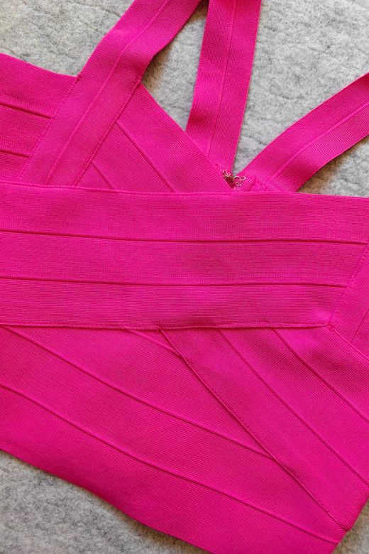 Woman wearing a figure flattering Jay Bandage Crop Top - Hot Pink BODYCON COLLECTION