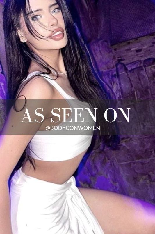 Woman wearing a figure flattering Jay Bandage Crop Top - Pearl White BODYCON COLLECTION