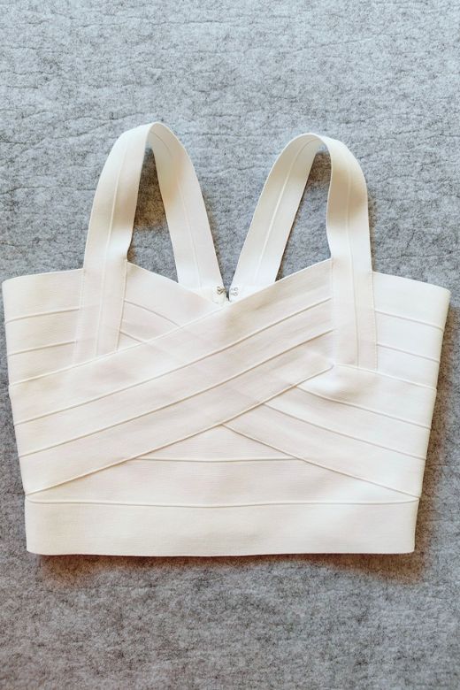 Woman wearing a figure flattering Jay Bandage Crop Top - Pearl White BODYCON COLLECTION