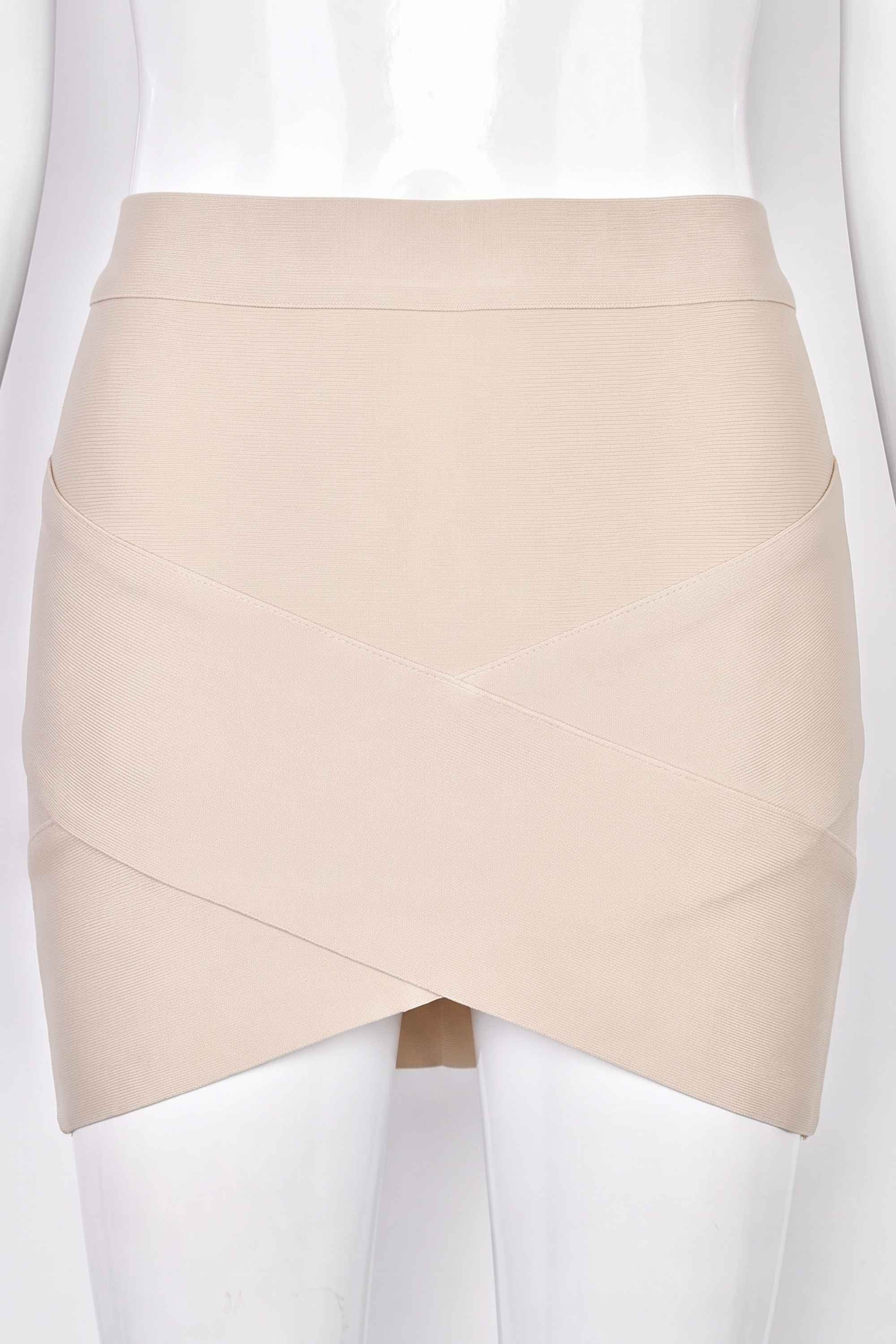 Woman wearing a figure flattering Jay High Waist Bandage Mini Skirt - Cream BODYCON COLLECTION