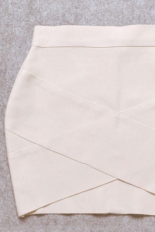 Woman wearing a figure flattering Jay High Waist Bandage Mini Skirt - Cream BODYCON COLLECTION