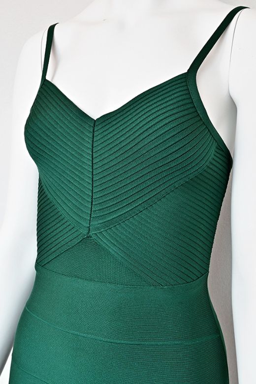 Woman wearing a figure flattering Jene Bandage Dress - Emerald Green BODYCON COLLECTION