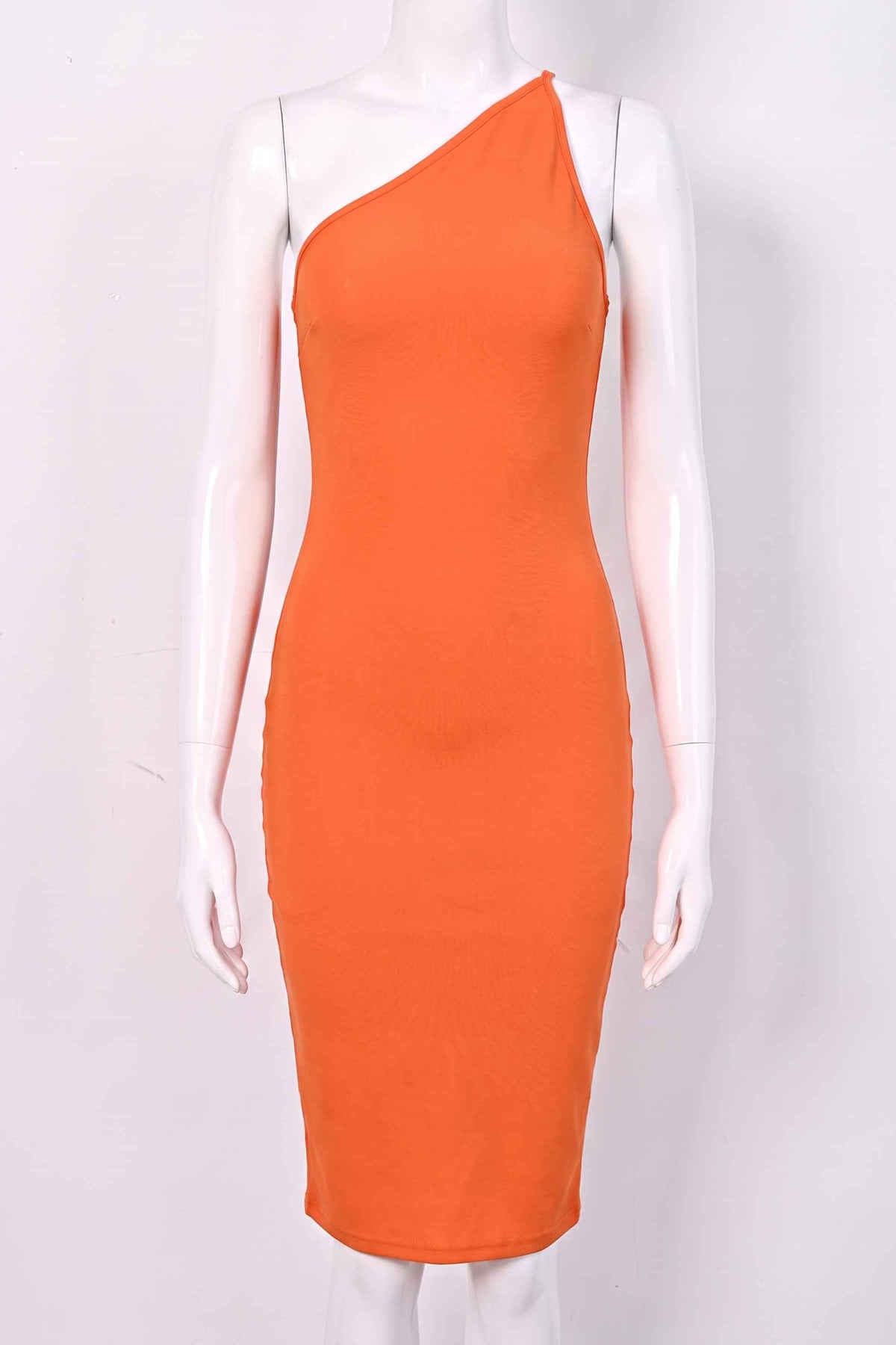 Woman wearing a figure flattering Joi Bodycon Midi Dress - Apricot Orange Bodycon Collection