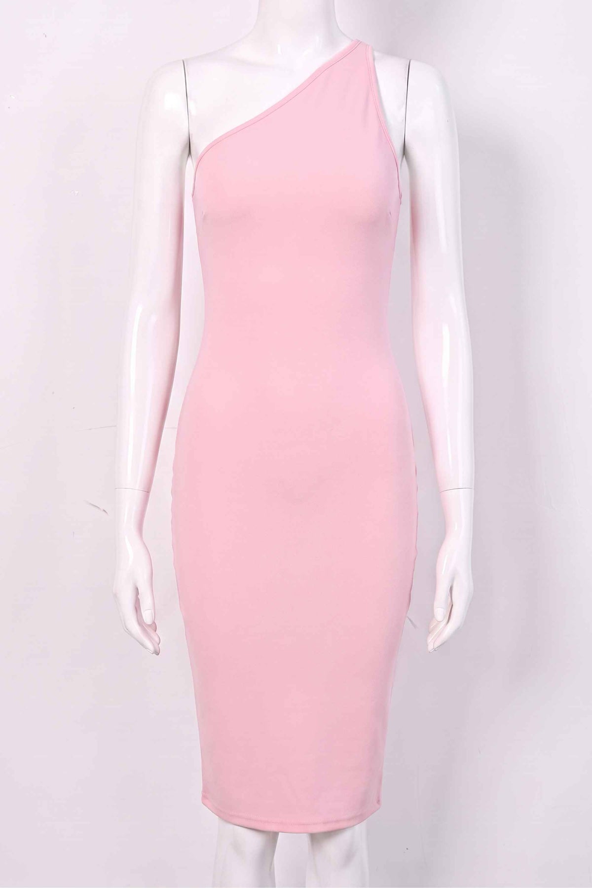 Woman wearing a figure flattering Joi Bodycon Midi Dress - Dusty Pink Bodycon Collection