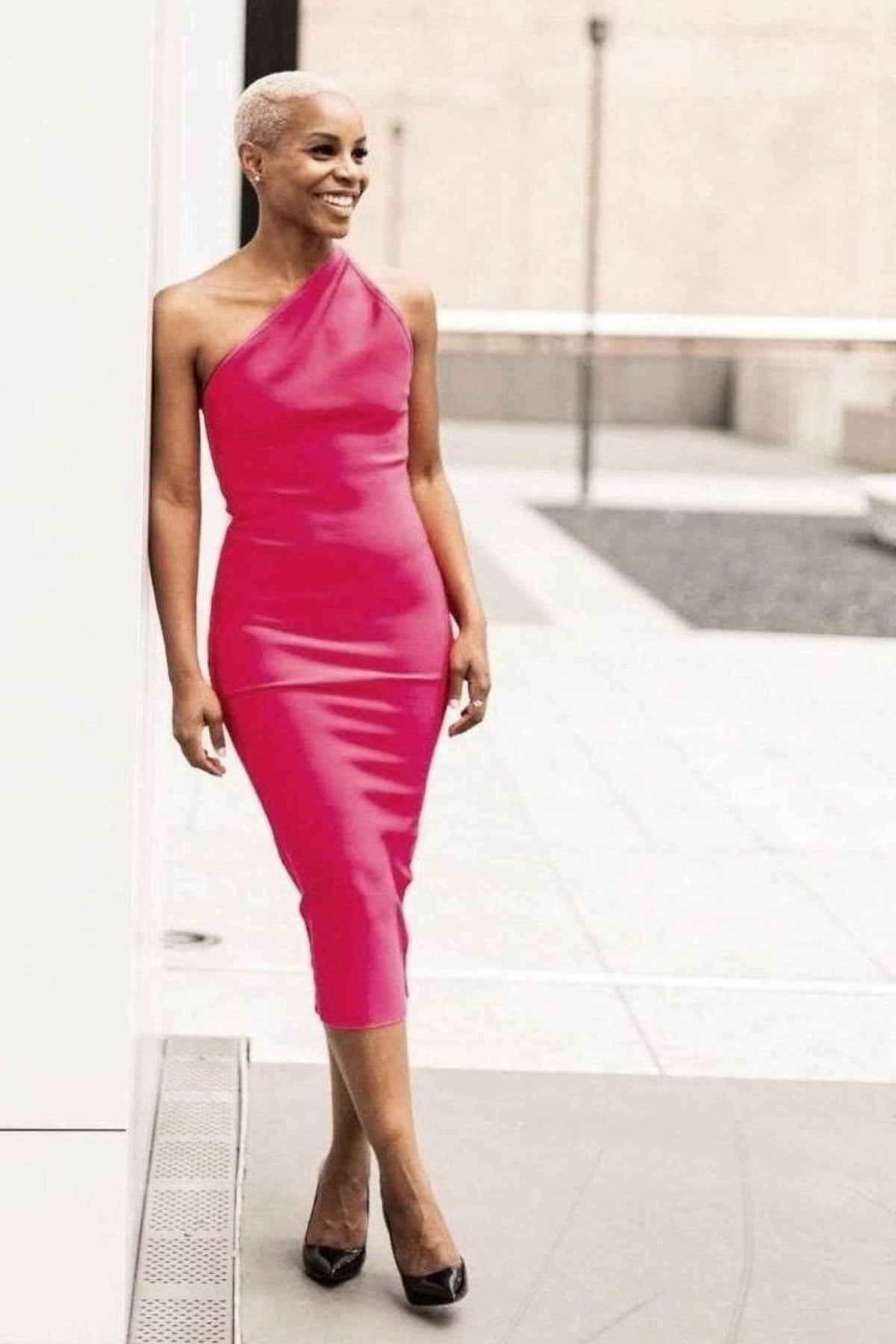 Woman wearing a figure flattering Joi Bodycon Midi Dress - Dusty Pink Bodycon Collection