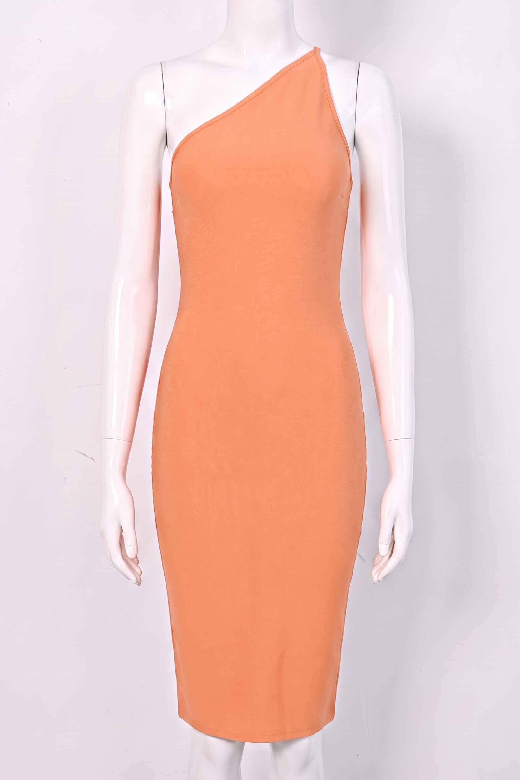 Woman wearing a figure flattering Joi Bodycon Midi Dress - Peach Bodycon Collection