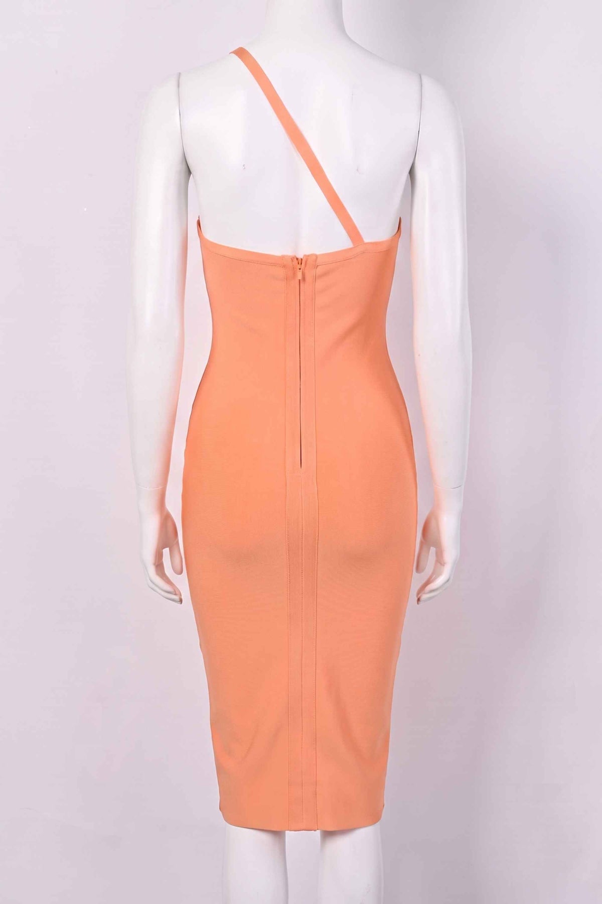 Woman wearing a figure flattering Joi Bodycon Midi Dress - Peach Bodycon Collection