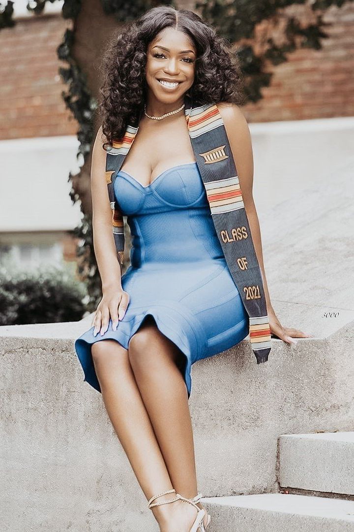 Woman wearing a figure flattering Joy Bandage Midi Dress - Pearl White Bodycon Collection
