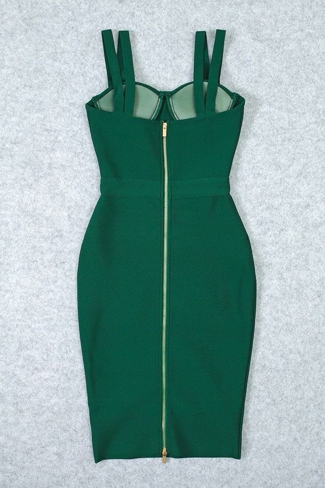 Woman wearing a figure flattering Kate Bandage Dress - Emerald Green Bodycon Collection