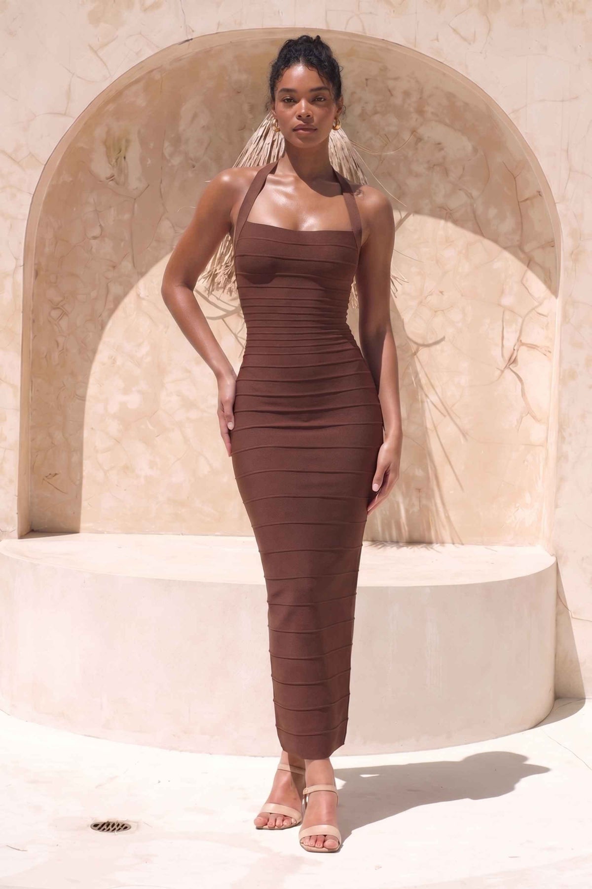 Woman wearing a figure flattering Kia Bandage Maxi Dress - Chocolate Brown BODYCON COLLECTION Pty Ltd