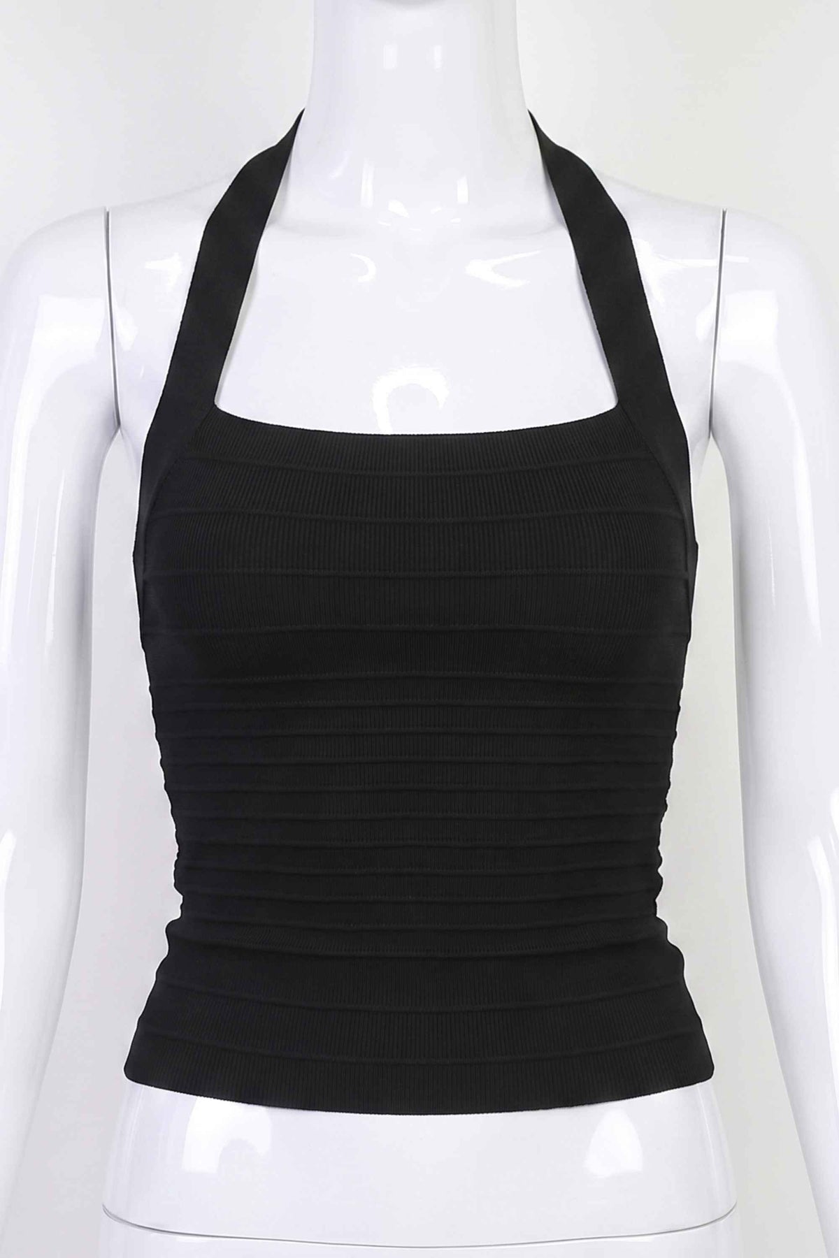 Woman wearing a figure flattering Kia Bandage Top - Classic Black BODYCON COLLECTION Pty Ltd