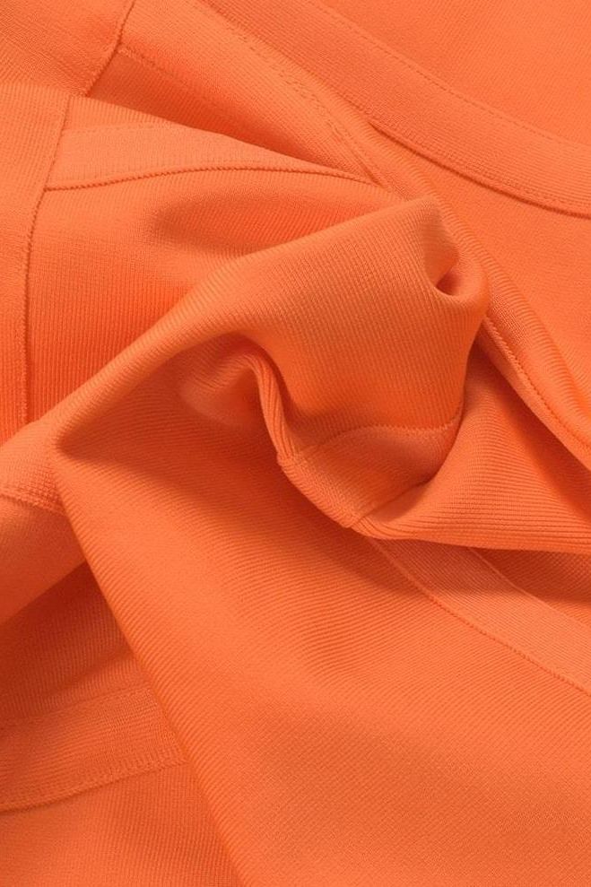 Woman wearing a figure flattering Kit Bandage Dress - Apricot Orange Bodycon Collection
