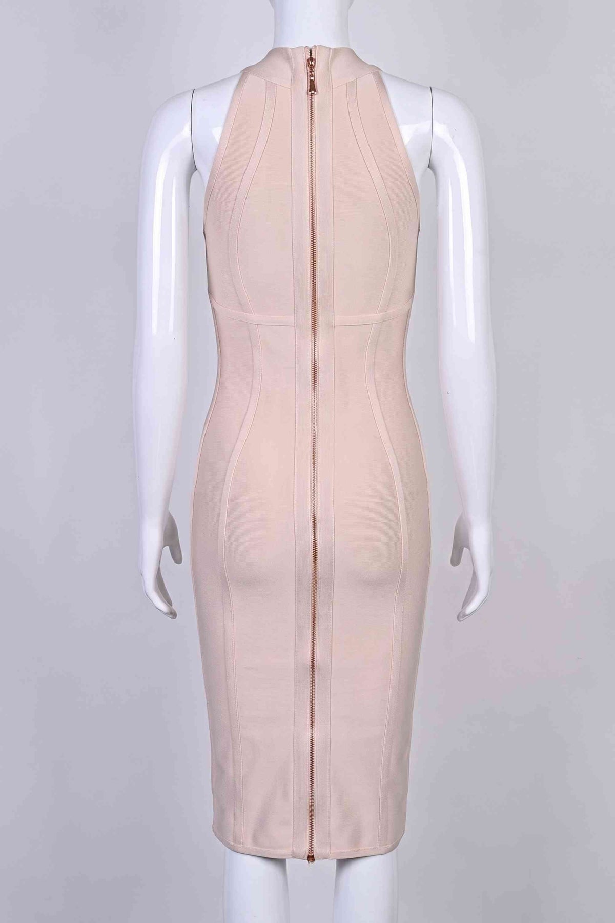 Woman wearing a figure flattering Lea Bandage Midi Dress - Beige Bodycon Collection
